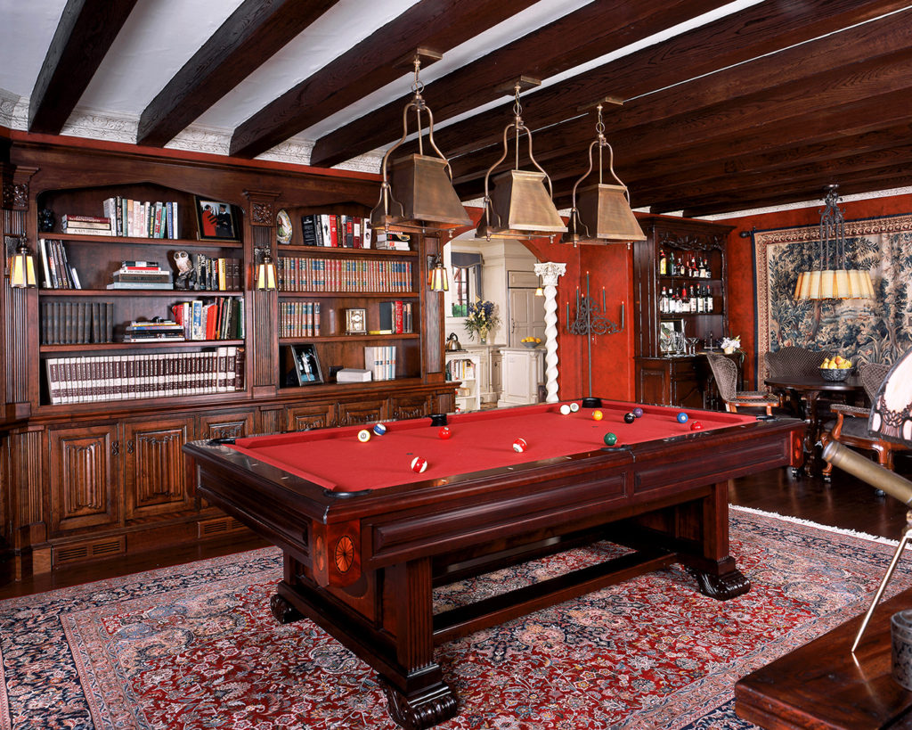 Family room with mahogany pool table, linenfold cabinets