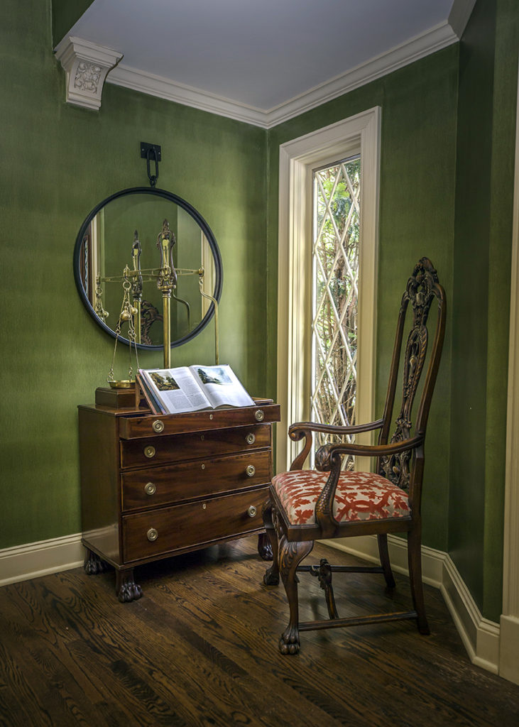 Foyer with antique chest, mirror and chair